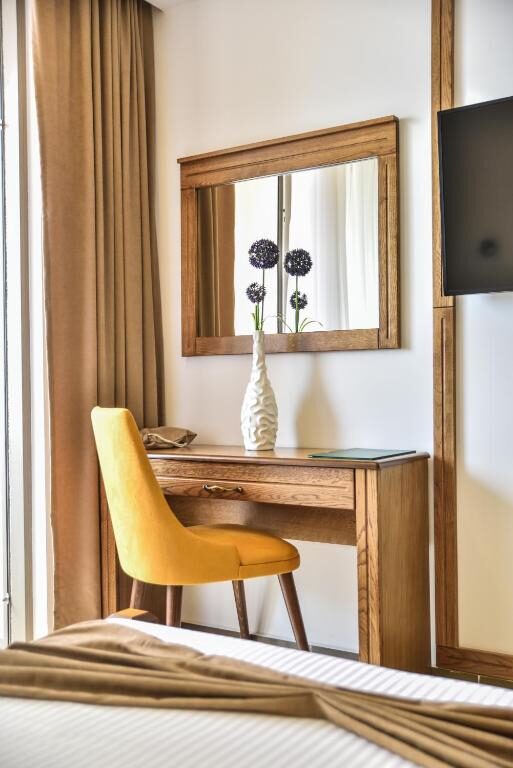 Desk, mirror and chair detail in a room at Hotel Prova