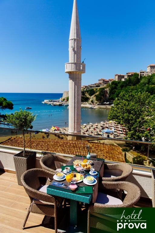 Breakfast served on the rooftop terrace of Hotel Prova above the beach in Ulcinj